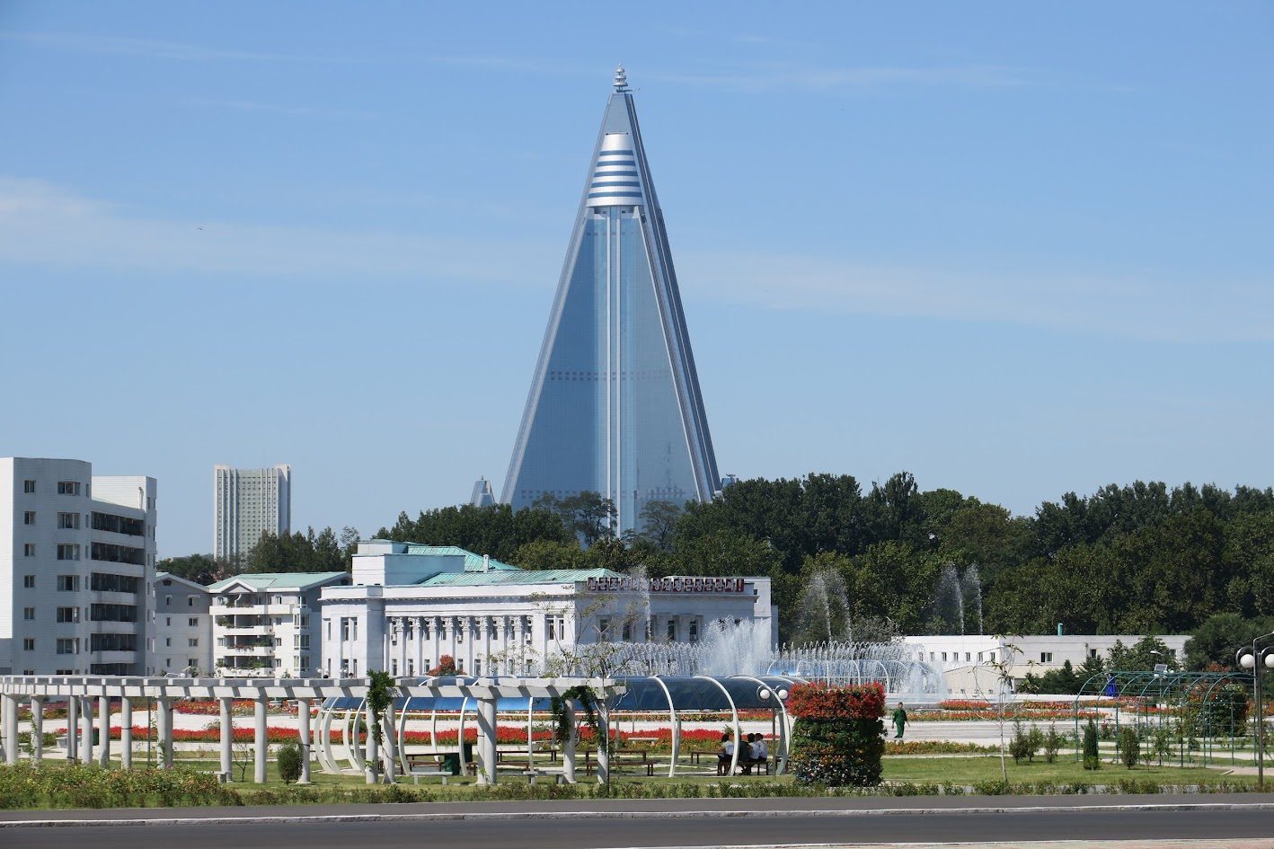 The pyramid-shaped Ryugyong Hotel rising over fountains in Pyongyang
